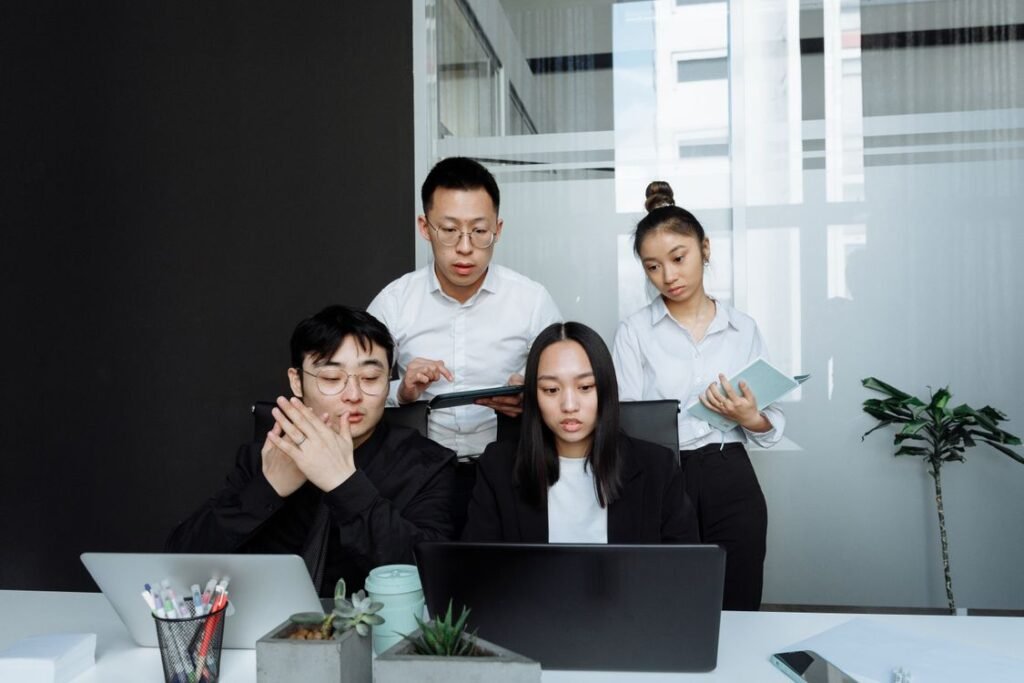 Korean office workers in a team meeting representing Korean work culture 2026