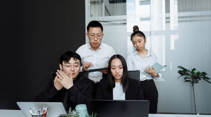 Korean office workers in a team meeting representing Korean work culture 2026