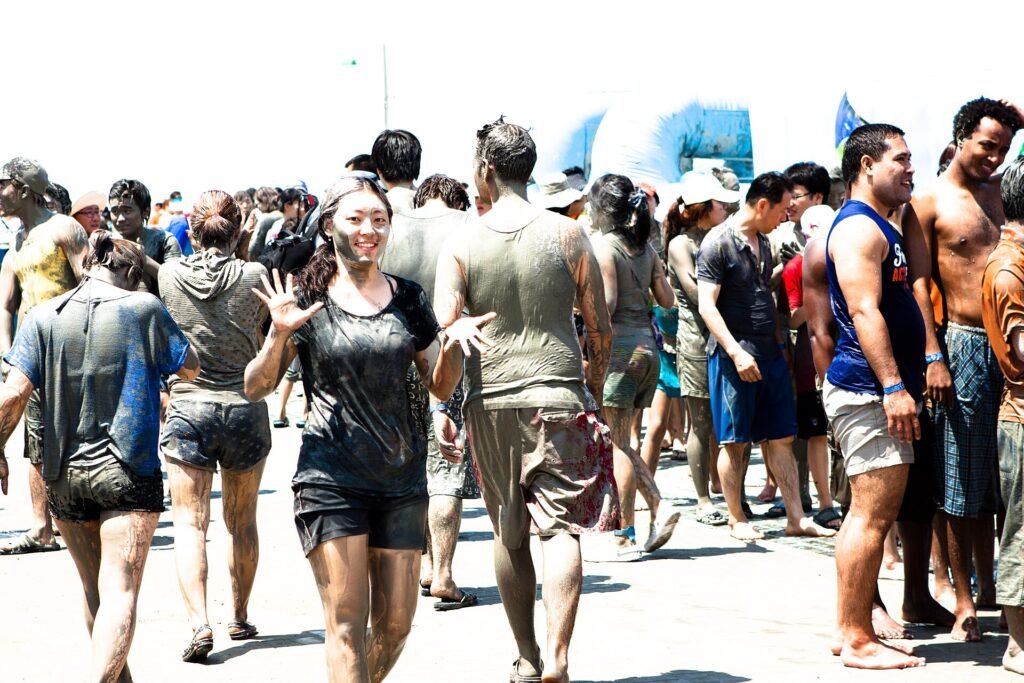 Crowds covered in mud at the Boryeong Mud Festival