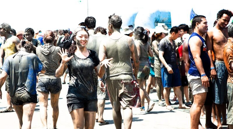 Crowds covered in mud at the Boryeong Mud Festival